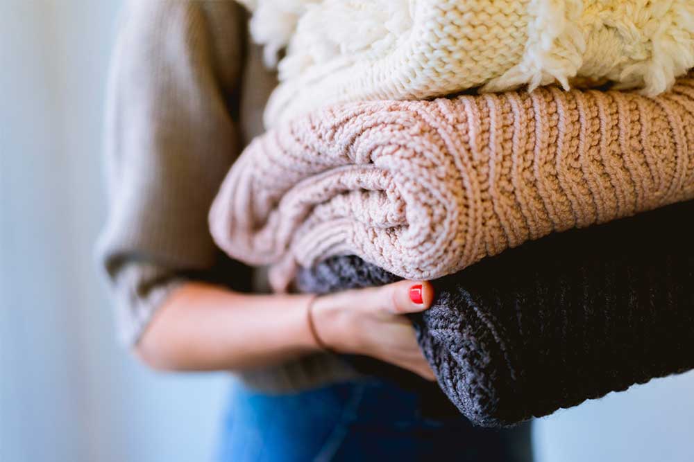 9 sustainable sweaters that make it OK summer’s over