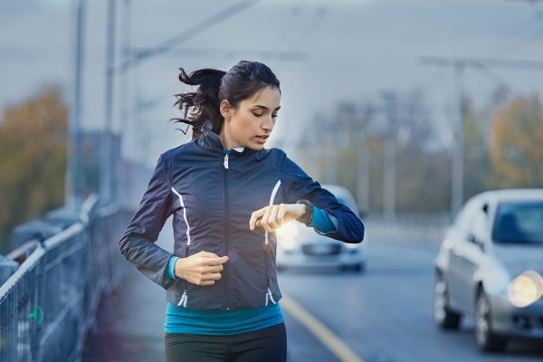 woman running looking at watch