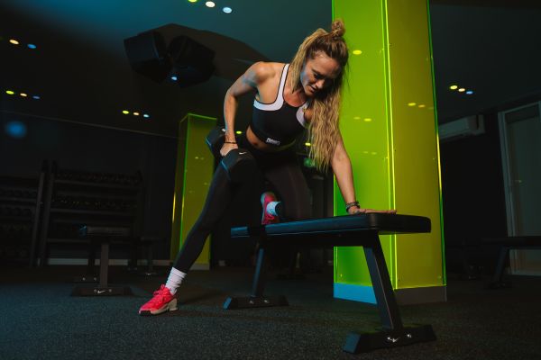 Woman training with weights