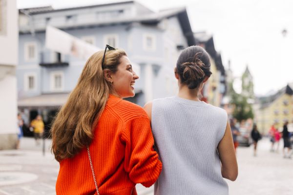 TwoWomen Looking Around Alpine Town Kitzbuhel